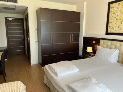 Letto o letti in una camera di GREEN GARDEN Resort - Smart Hotel