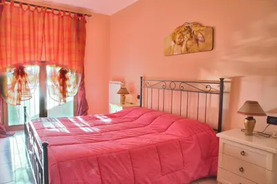 Letto o letti in una camera di Agriturismo Il Melograno