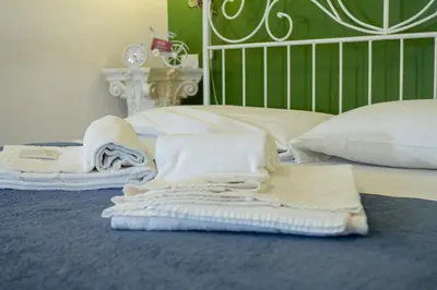Letto o letti in una camera di Madam Treviso
