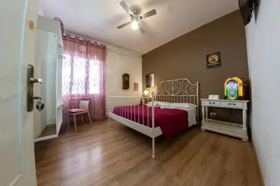 Letto o letti in una camera di Madam Treviso