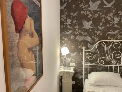 Letto o letti in una camera di Madam Treviso
