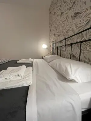 Letto o letti in una camera di Madam Treviso