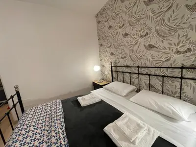Letto o letti in una camera di Madam Treviso