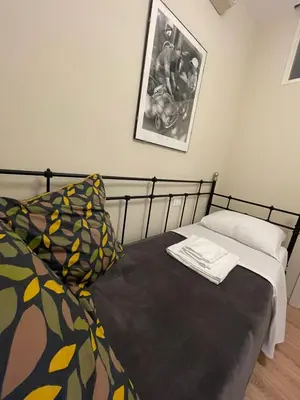 Letto o letti in una camera di Madam Treviso