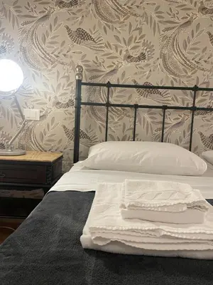 Letto o letti in una camera di Madam Treviso