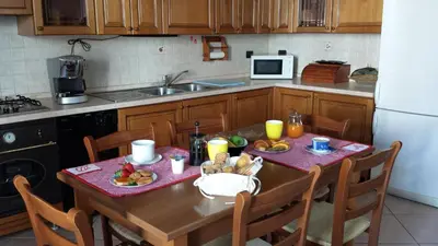 Cucina o angolo cottura di Appartamento Acero Rosso