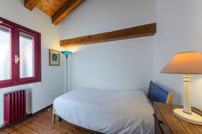 Letto o letti in una camera di Novalesi Red House