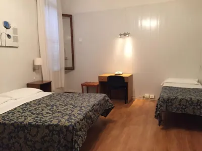 Letto o letti in una camera di Hotel Caneva