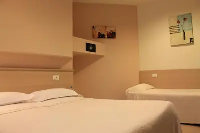 Letto o letti in una camera di Park Hotel Italia