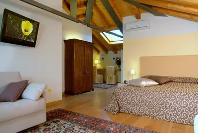 Letto o letti in una camera di Hotel Rovere