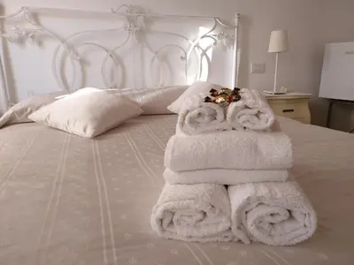 Letto o letti in una camera di Al Piccolo Clarin