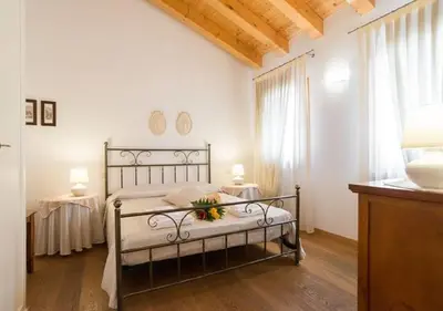 Letto o letti in una camera di Al Piccolo Clarin