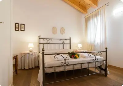 Letto o letti in una camera di Al Piccolo Clarin