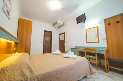 Letto o letti in una camera di Hotel Grand Prix
