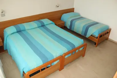 Letto o letti in una camera di Hotel Caravel