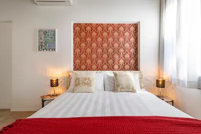 Letto o letti in una camera di Ca' dell'Arciere Apartments