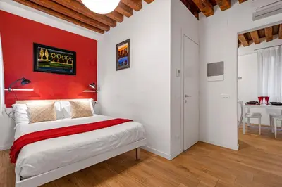 Letto o letti in una camera di Ca' dell'Arciere Apartments