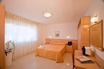 Letto o letti in una camera di Hotel Jonni