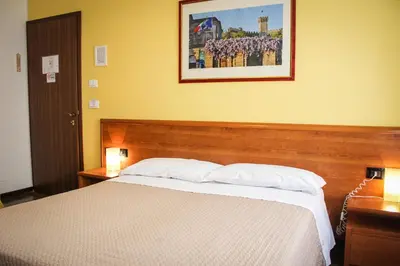 Letto o letti in una camera di Hotel Centrale