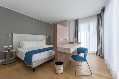 Letto o letti in una camera di Hesperia Hotel & Residence