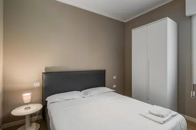 Letto o letti in una camera di JOIVY Padova Porta San Giovanni