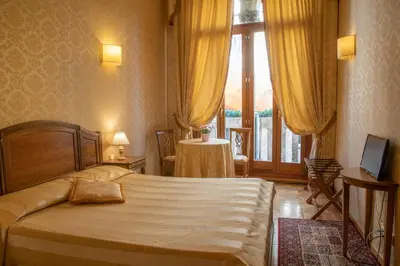 Letto o letti in una camera di Dimora Al Doge Beato vista canale