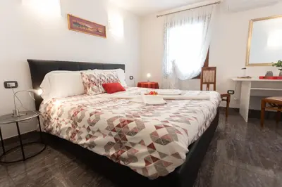 Letto o letti in una camera di B&B Antico Orologio