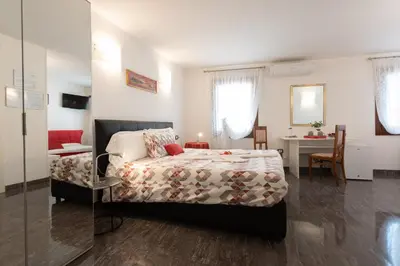 Letto o letti in una camera di B&B Antico Orologio