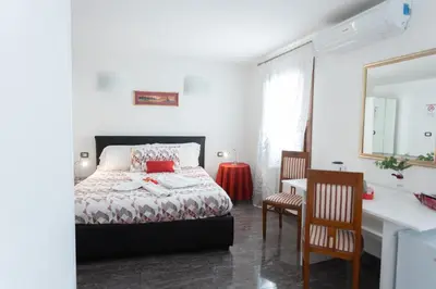 Letto o letti in una camera di B&B Antico Orologio