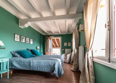 Letto o letti in una camera di Foresteria Borgoluce