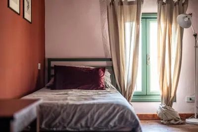 Letto o letti in una camera di Foresteria Borgoluce