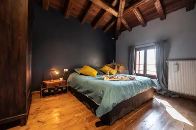 Letto o letti in una camera di Foresteria Borgoluce