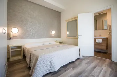 Letto o letti in una camera di Hotel Cristina