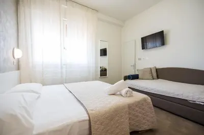 Letto o letti in una camera di Hotel Cristina