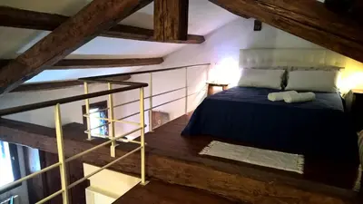Letto o letti in una camera di Loft Ca'Drasi