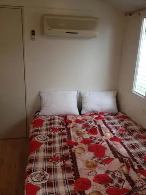 Letto o letti in una camera di Oliholiday Mobilehomes - Cavallino