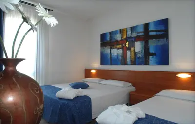 Letto o letti in una camera di Hotel Scaldaferro