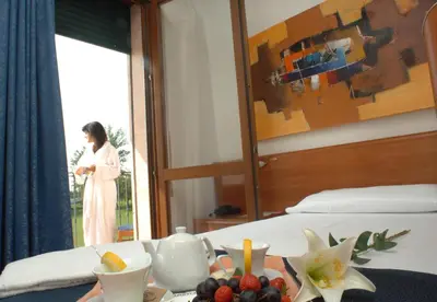Letto o letti in una camera di Hotel Scaldaferro