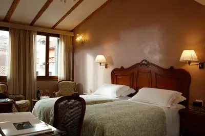 Letto o letti in una camera di Hotel Bisanzio