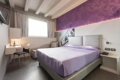 Letto o letti in una camera di Hotel Doge