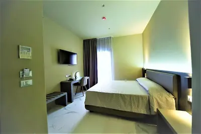 Letto o letti in una camera di Hotel Aaron