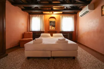 Letto o letti in una camera di Locanda Antica Venezia
