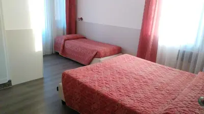 Letto o letti in una camera di Alla Bianca Hotel