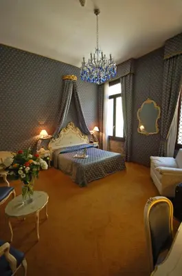 Letto o letti in una camera di Hotel Torino