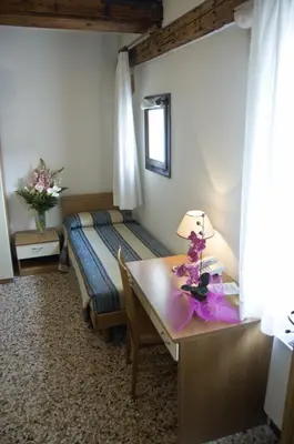 Letto o letti in una camera di Casa Sant'Andrea