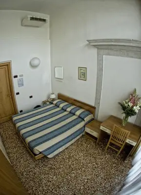 Letto o letti in una camera di Casa Sant'Andrea