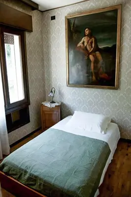 Letto o letti in una camera di Villa Tra' Monti