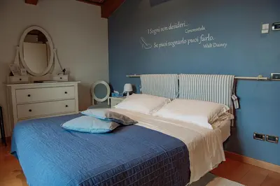 Letto o letti in una camera di Rosa del Grappa