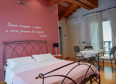 Letto o letti in una camera di Rosa del Grappa
