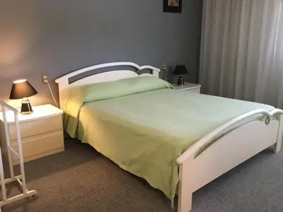 Letto o letti in una camera di Albergo Diana